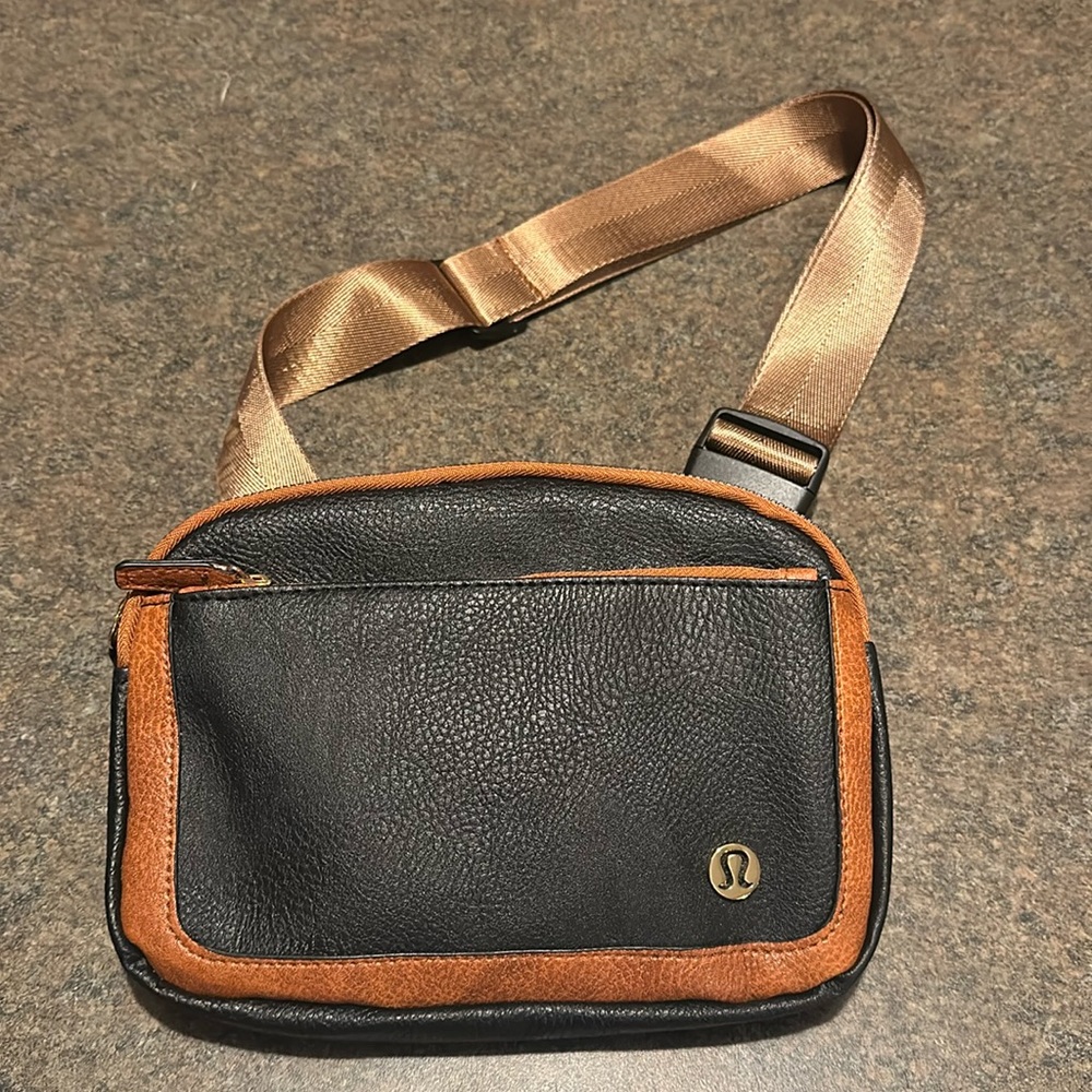 COPY - Lululemon Black with Brown Trim Leather Everywhere Belt Bag.